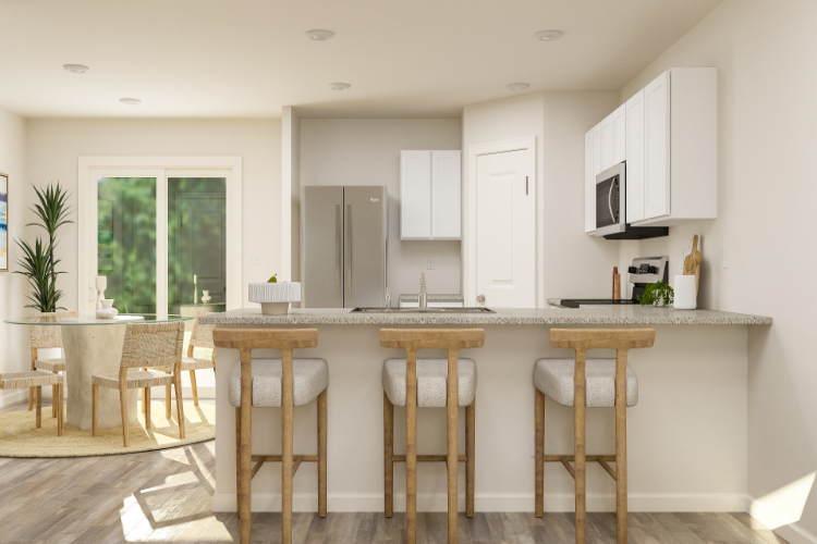 A kitchen with a table and chairs.