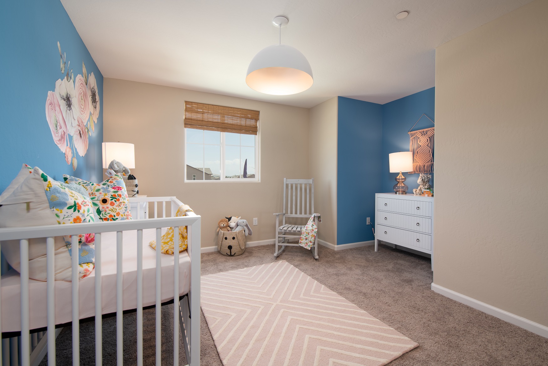 A baby crib in a room.