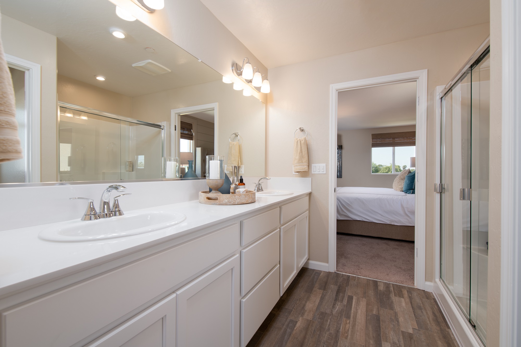 A bathroom with a large mirror.