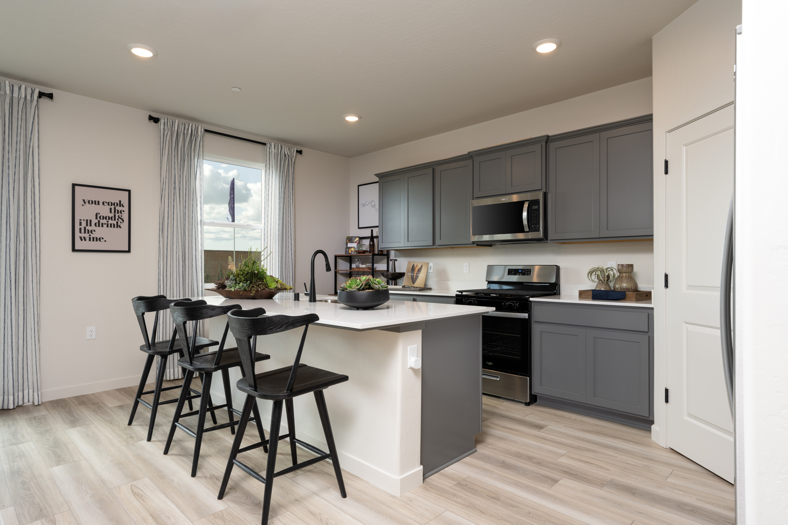 A kitchen with black appliances.