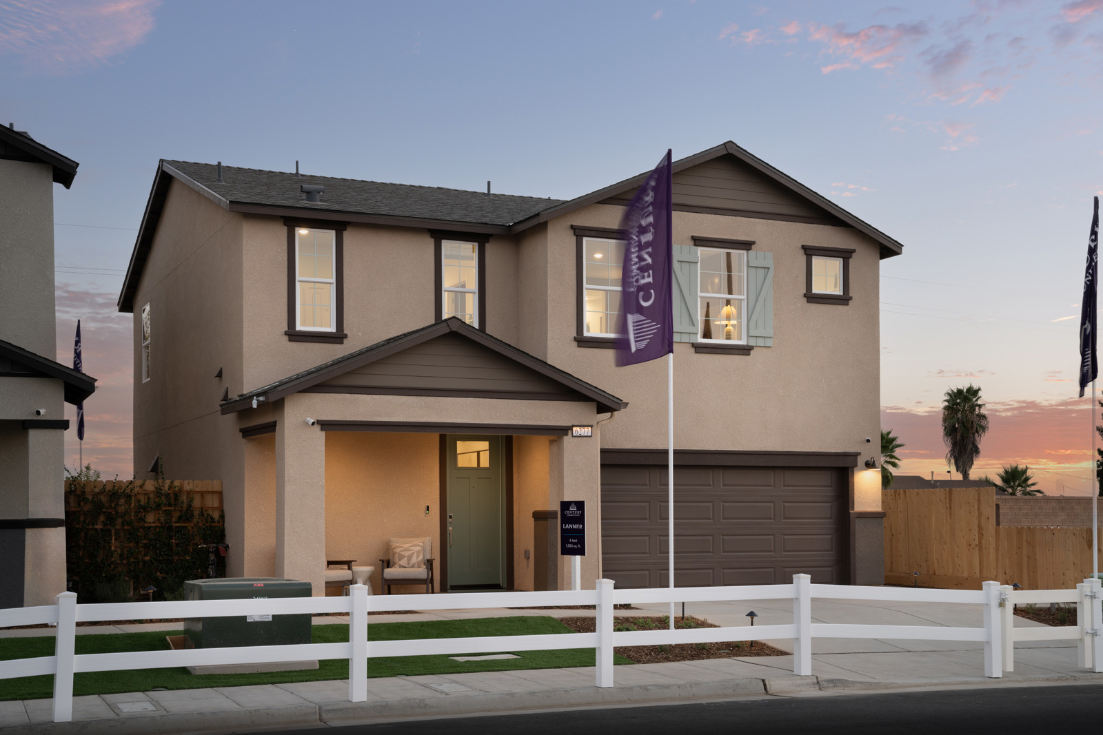 A house with a white picket fence.