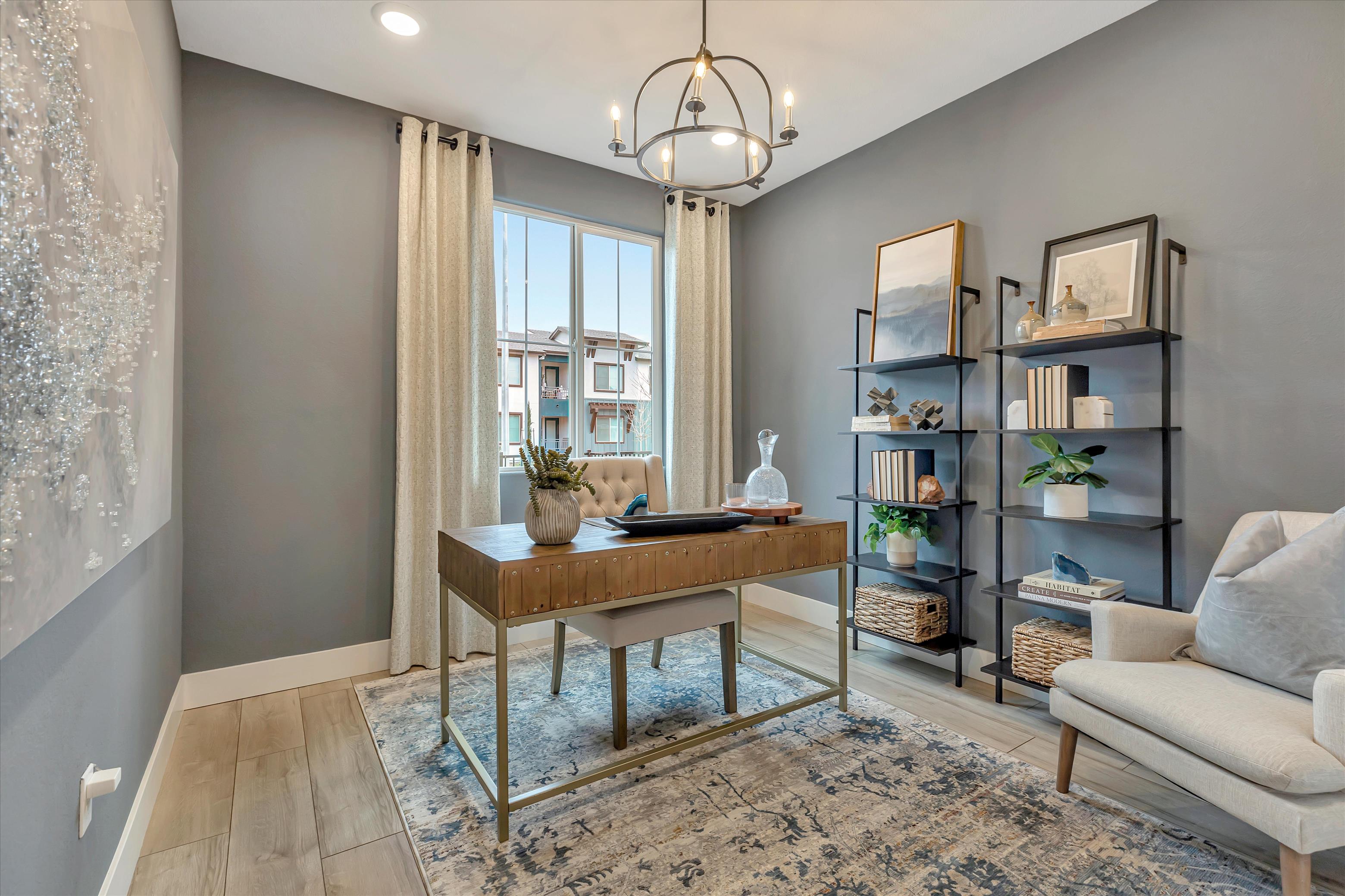A room with a table and shelves.