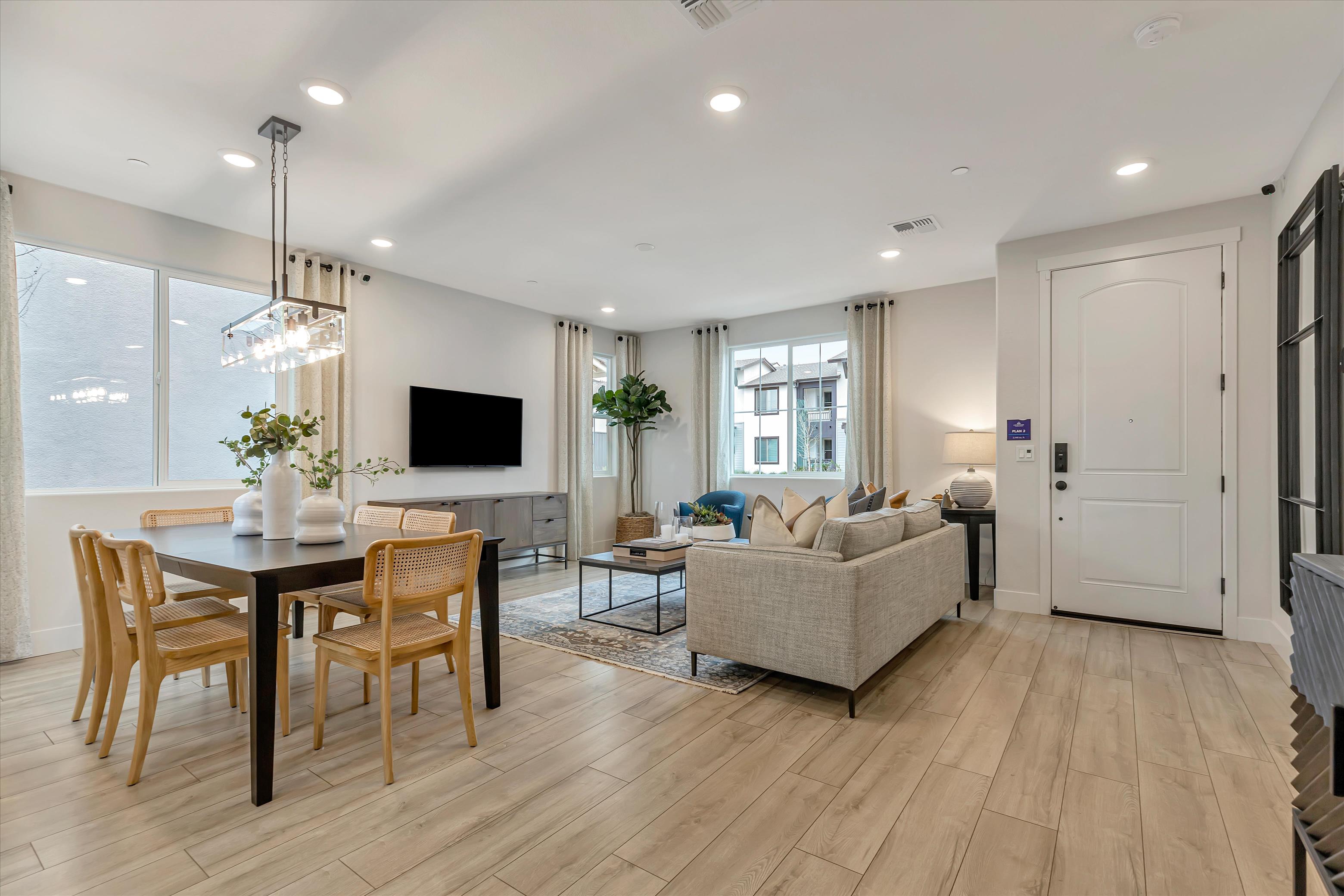 A living room with a wood floor.