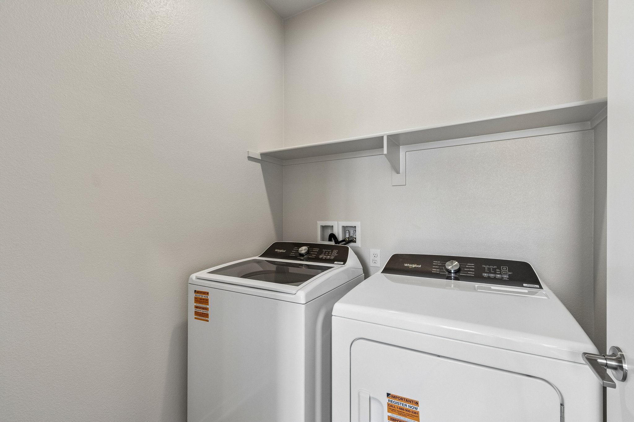 A stove and a refrigerator in a kitchen.