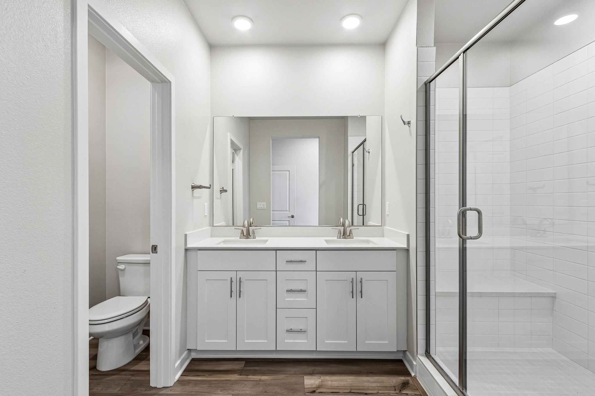 A bathroom with a glass shower.