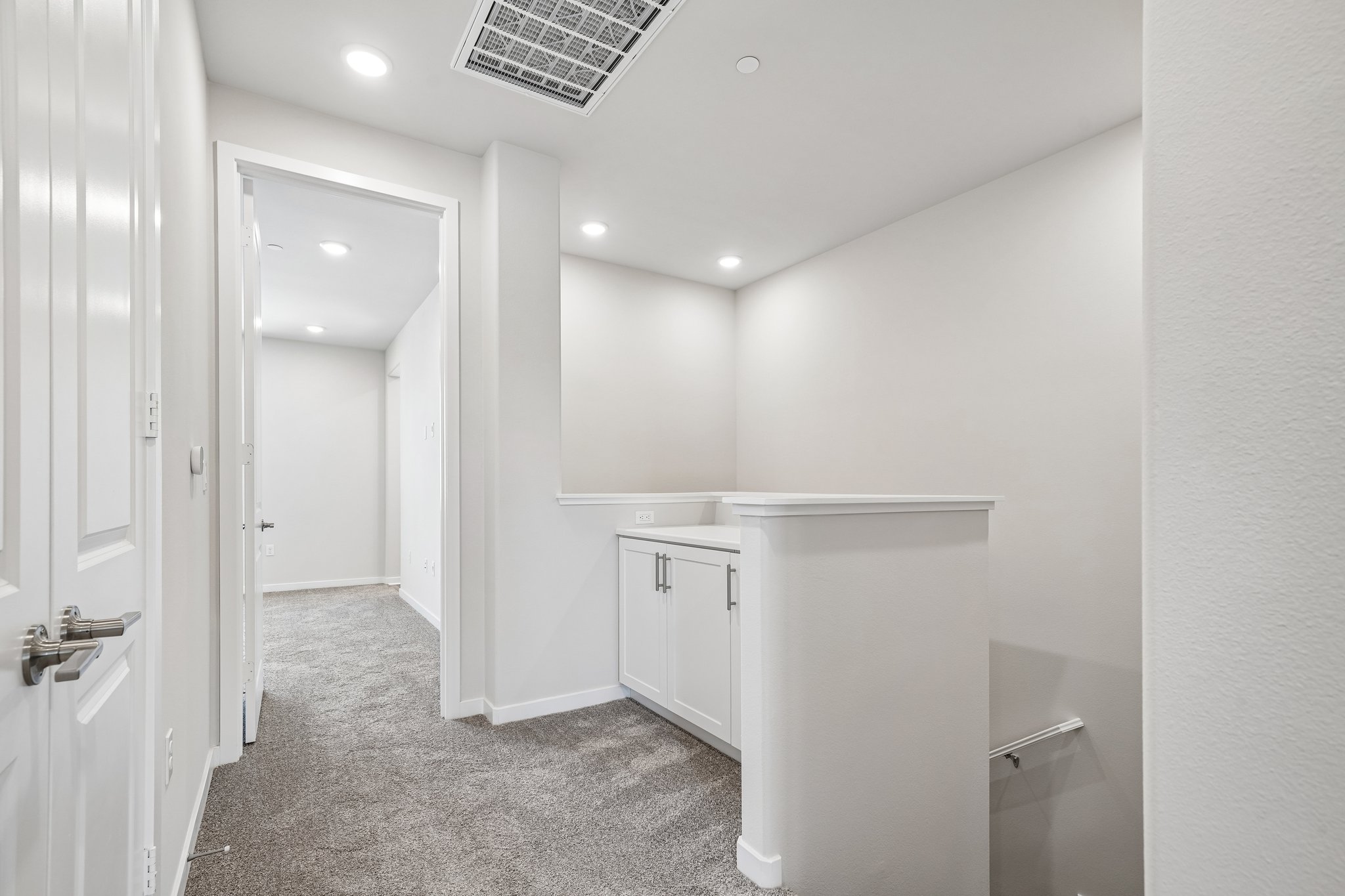 A bathroom with white walls.