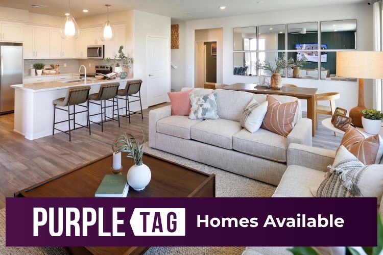A living room with a couch and a table.