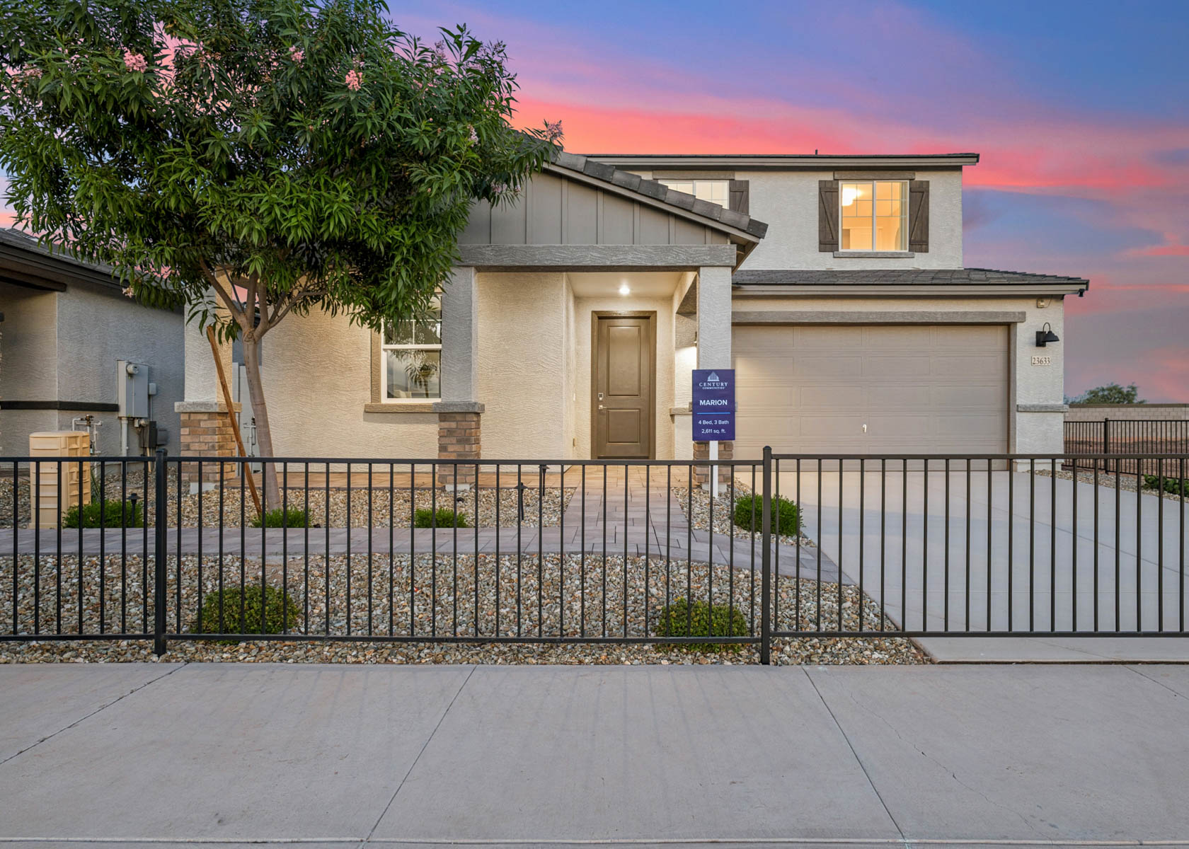 A house with a fence and trees.