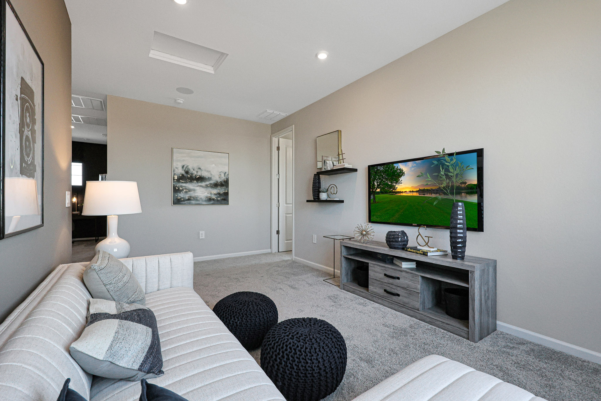A living room with a tv and couches.