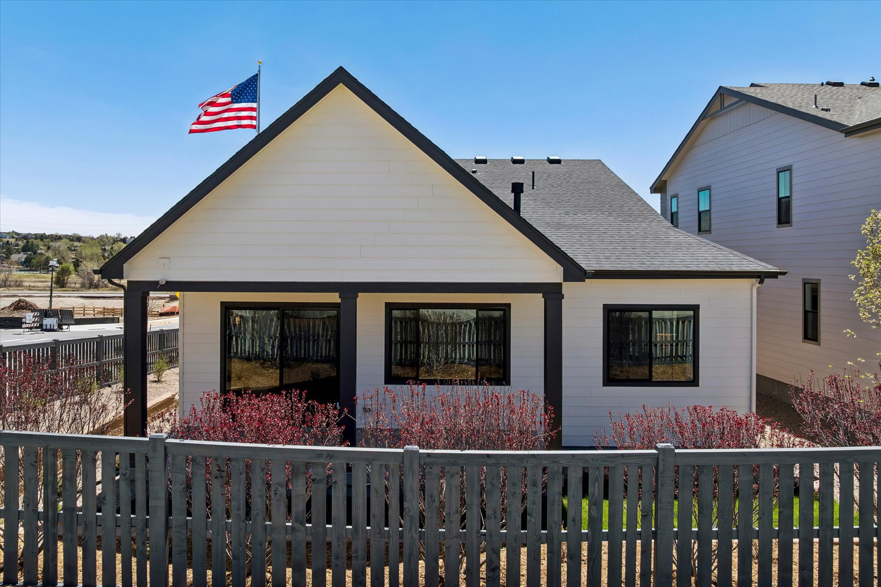 A house with a flag on the roof.
