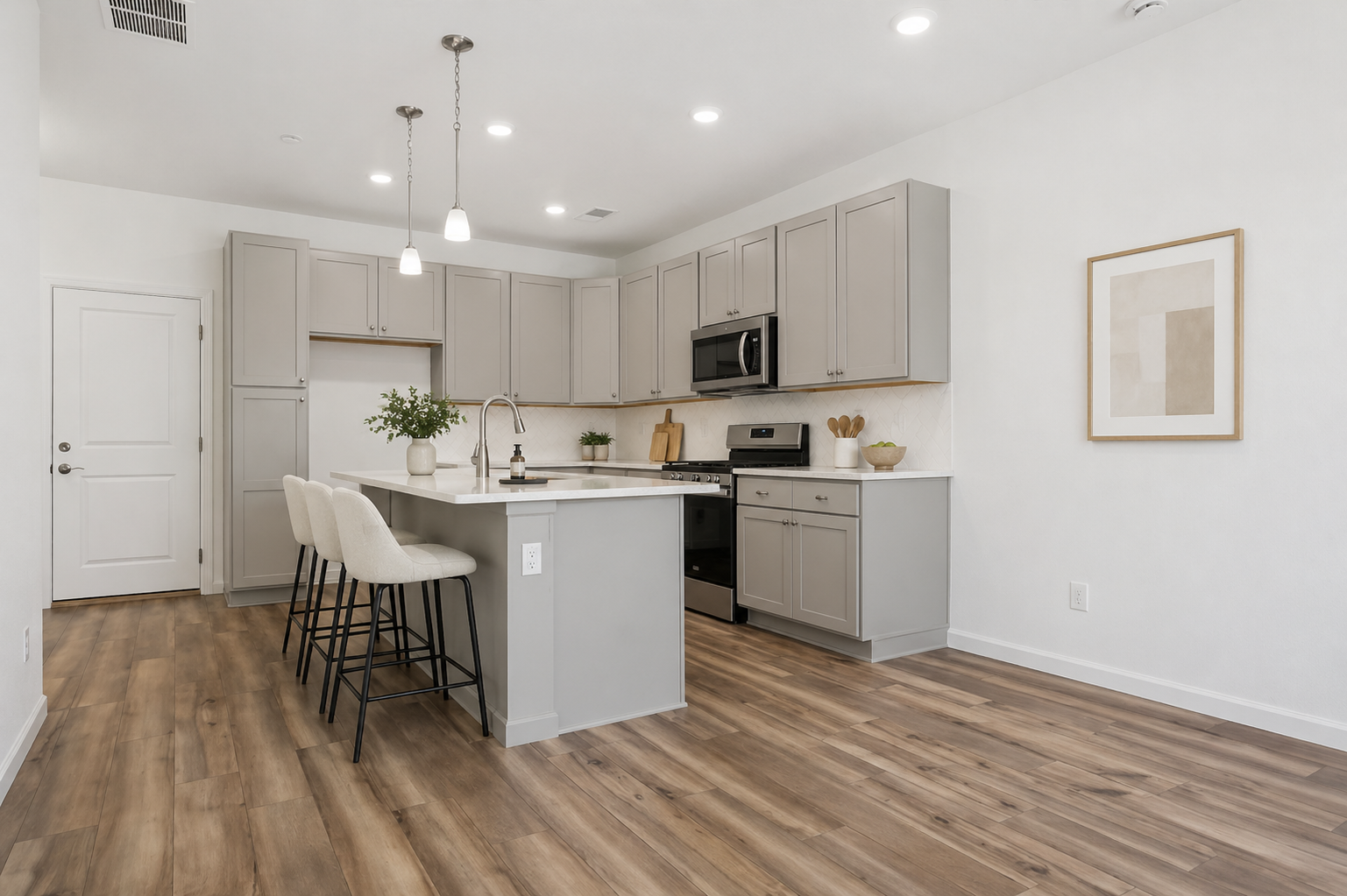 A kitchen with white cabinets.