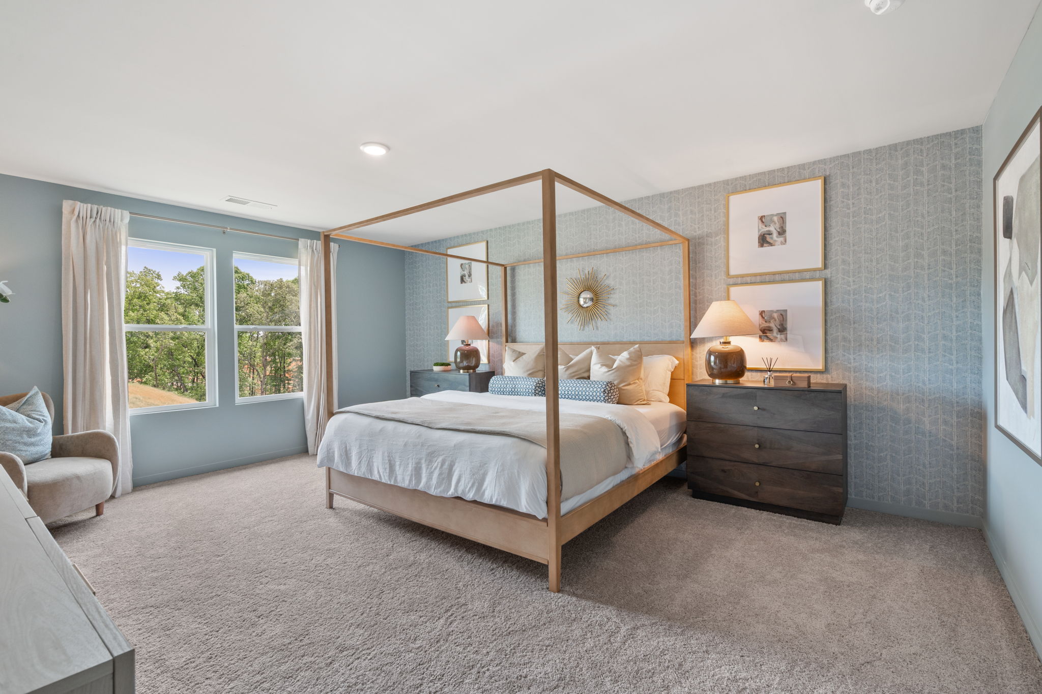 A bedroom with a large mirror.