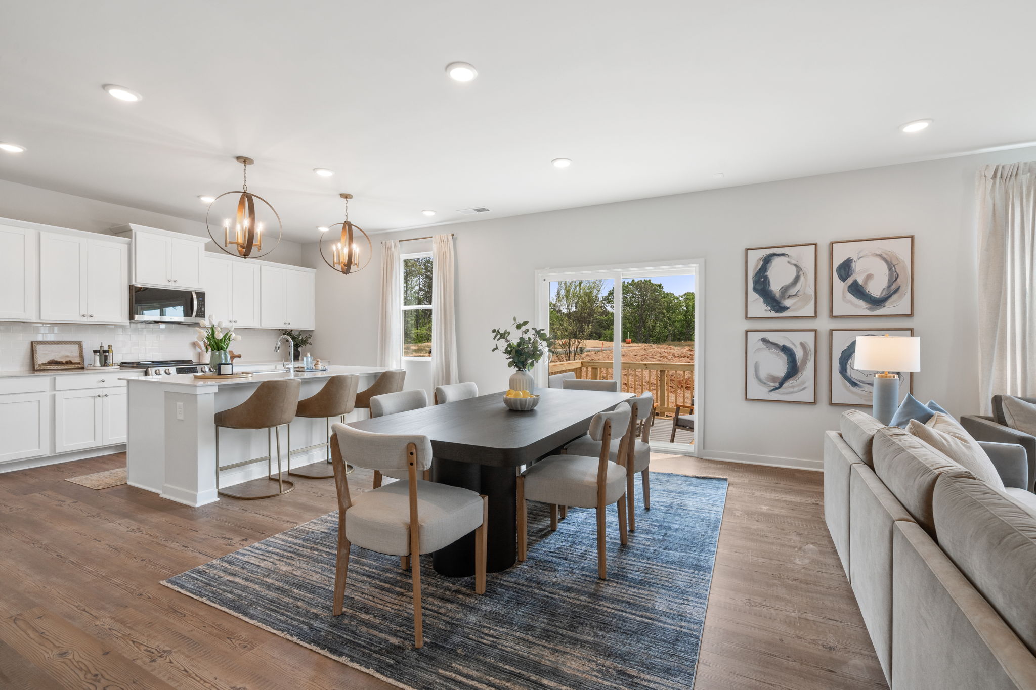 A large kitchen with a dining table.