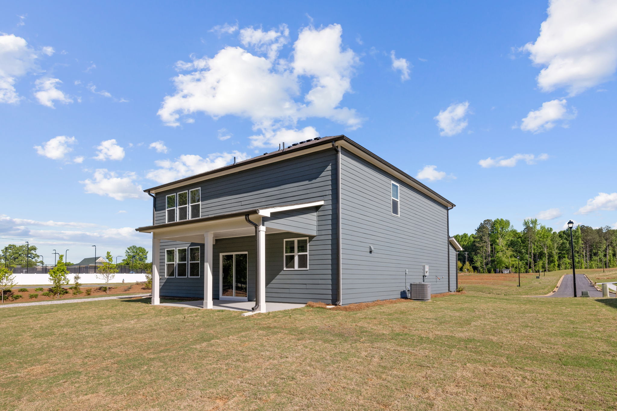 A house with a grass yard.