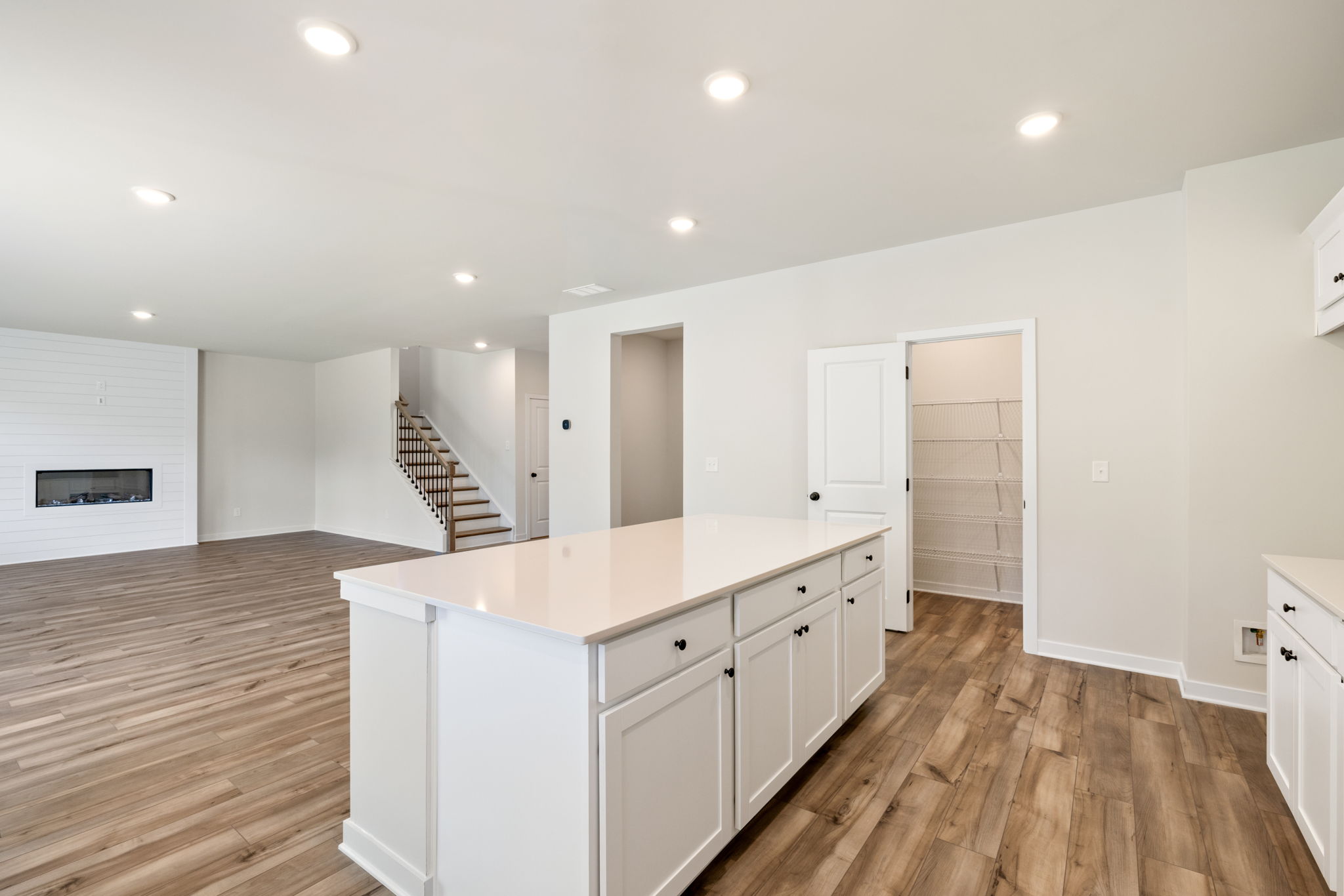 A large kitchen with white cabinets.