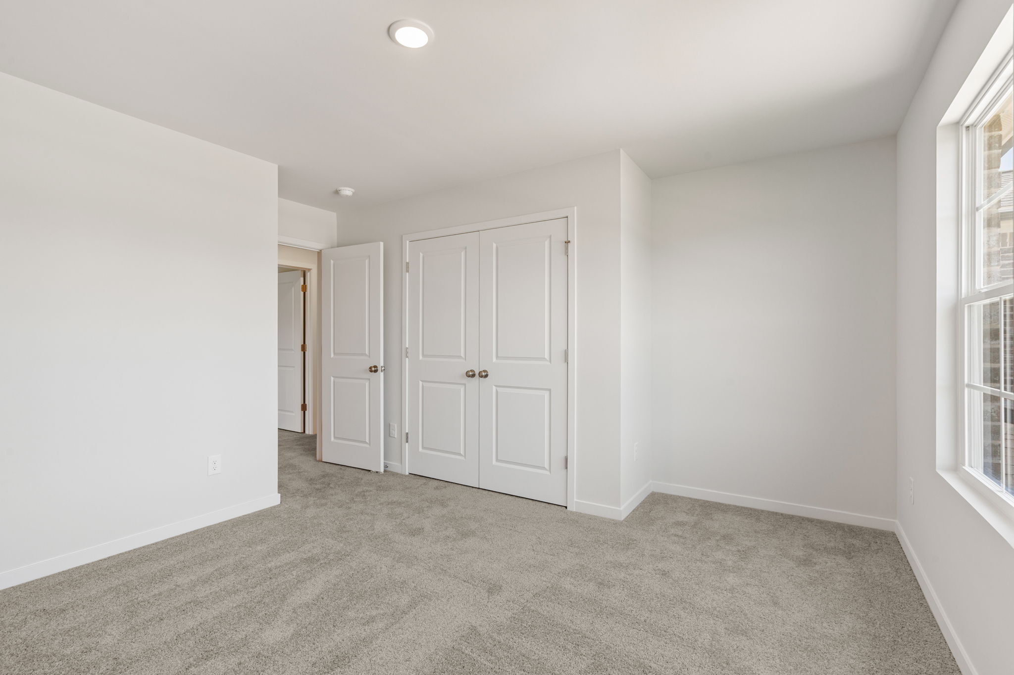 A room with white doors.