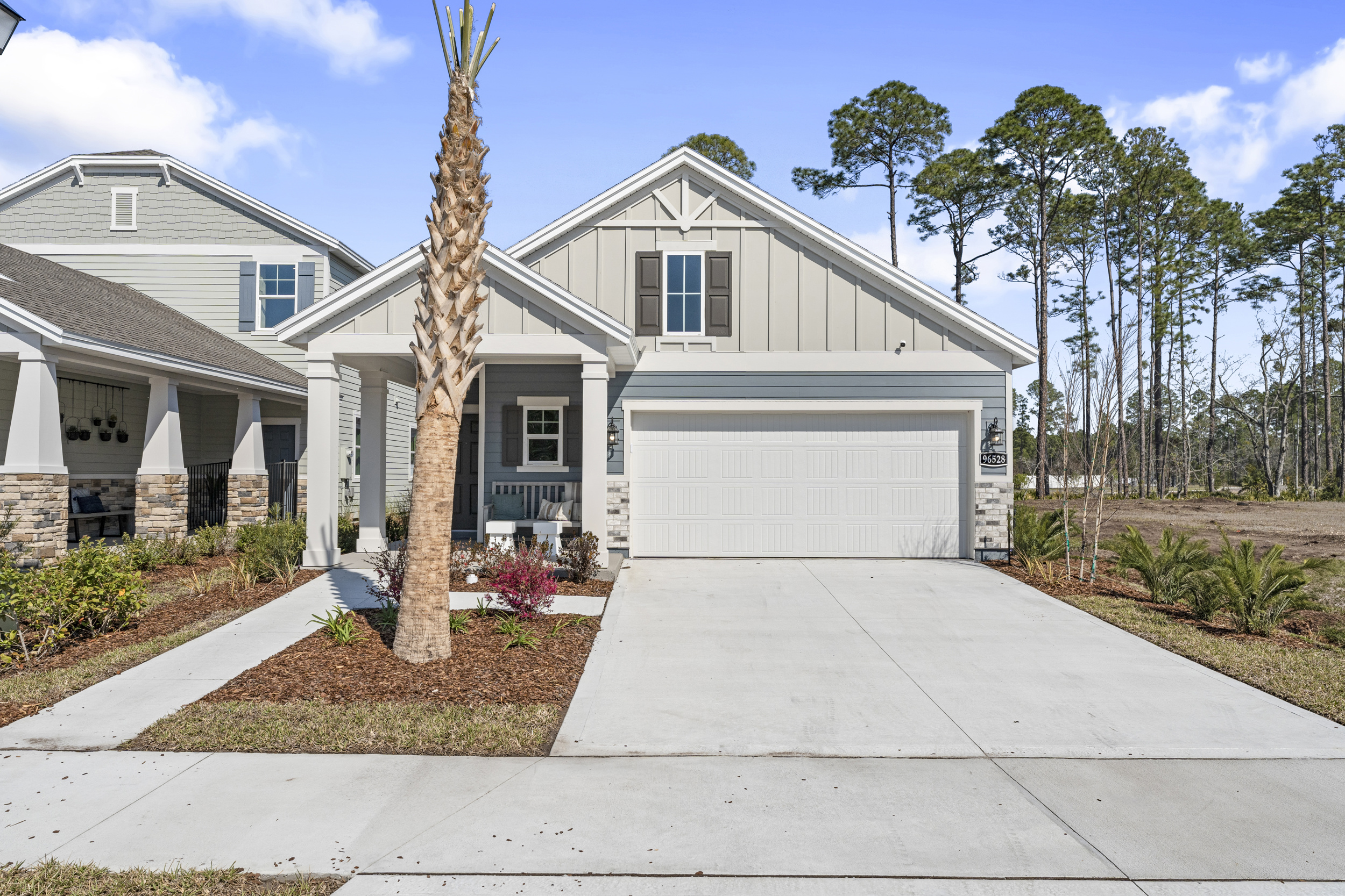 A white house with a garage.
