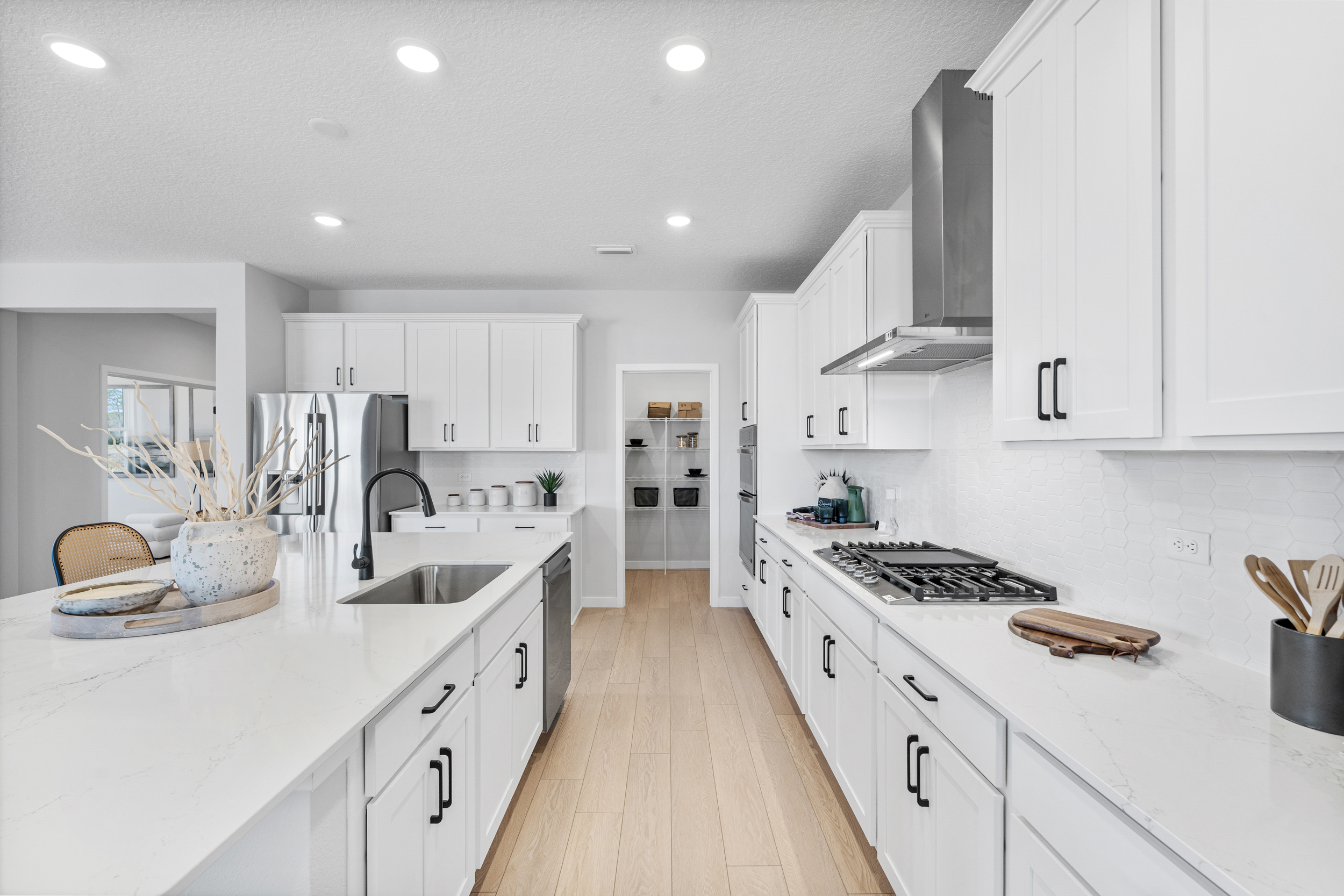 Kenai Model Home Chef's Kitchen with Walk-In Pantry at Reserve East