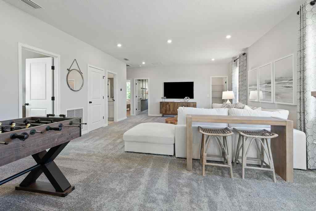 A large room with a bed and a couch.