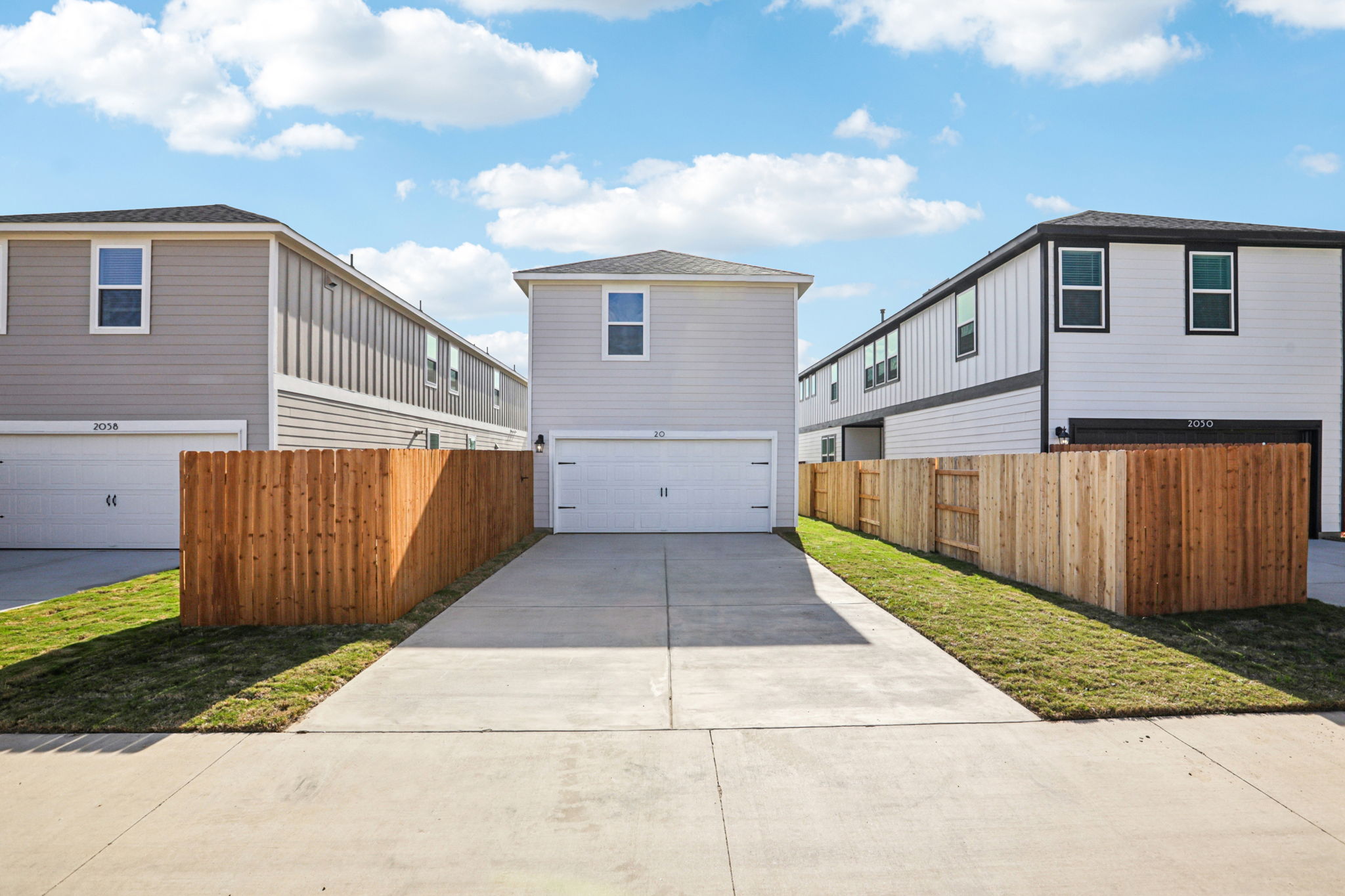 A group of buildings with a fence.