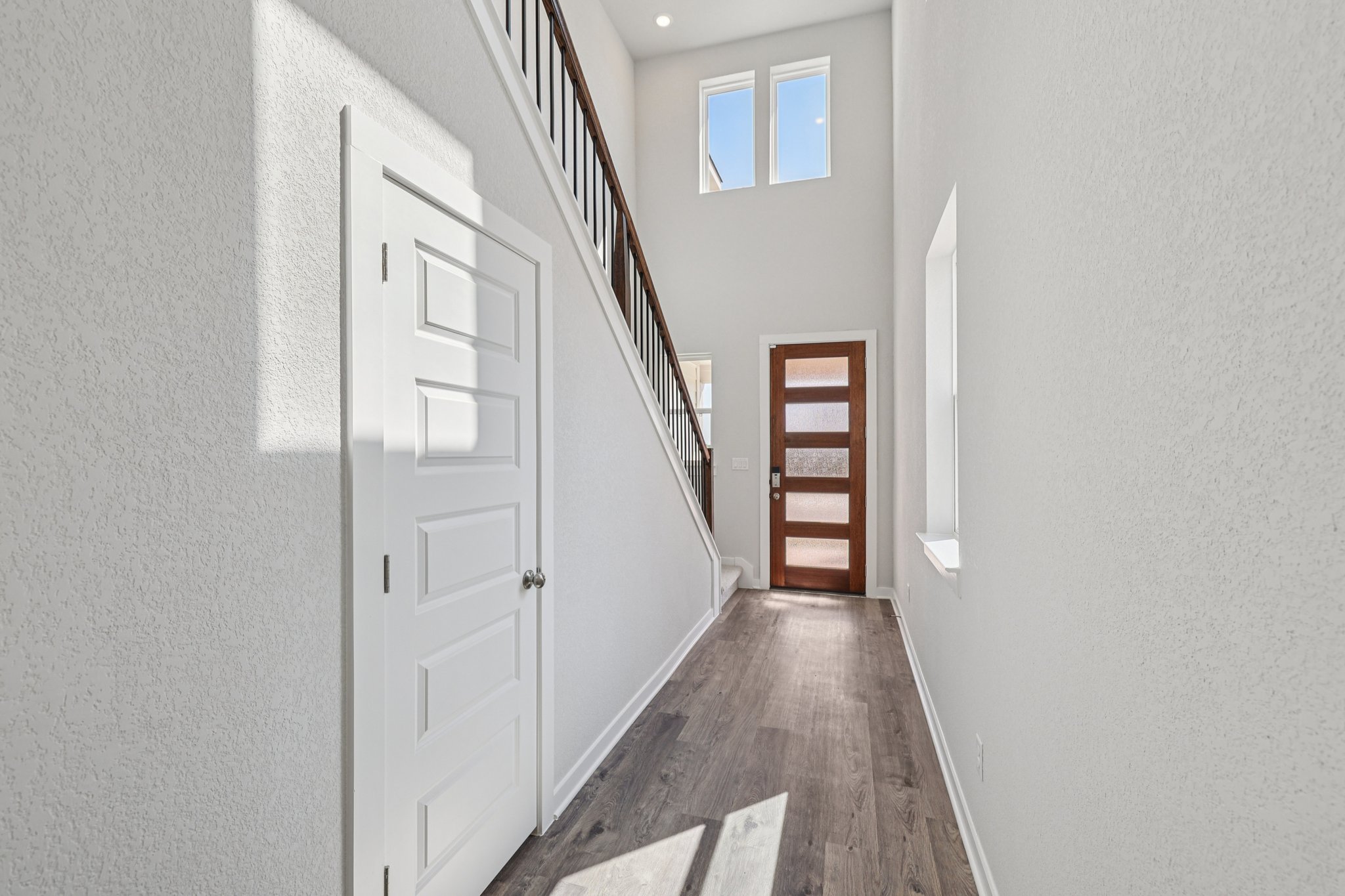 A hallway with white doors.