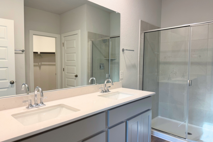 A bathroom with a glass shower.