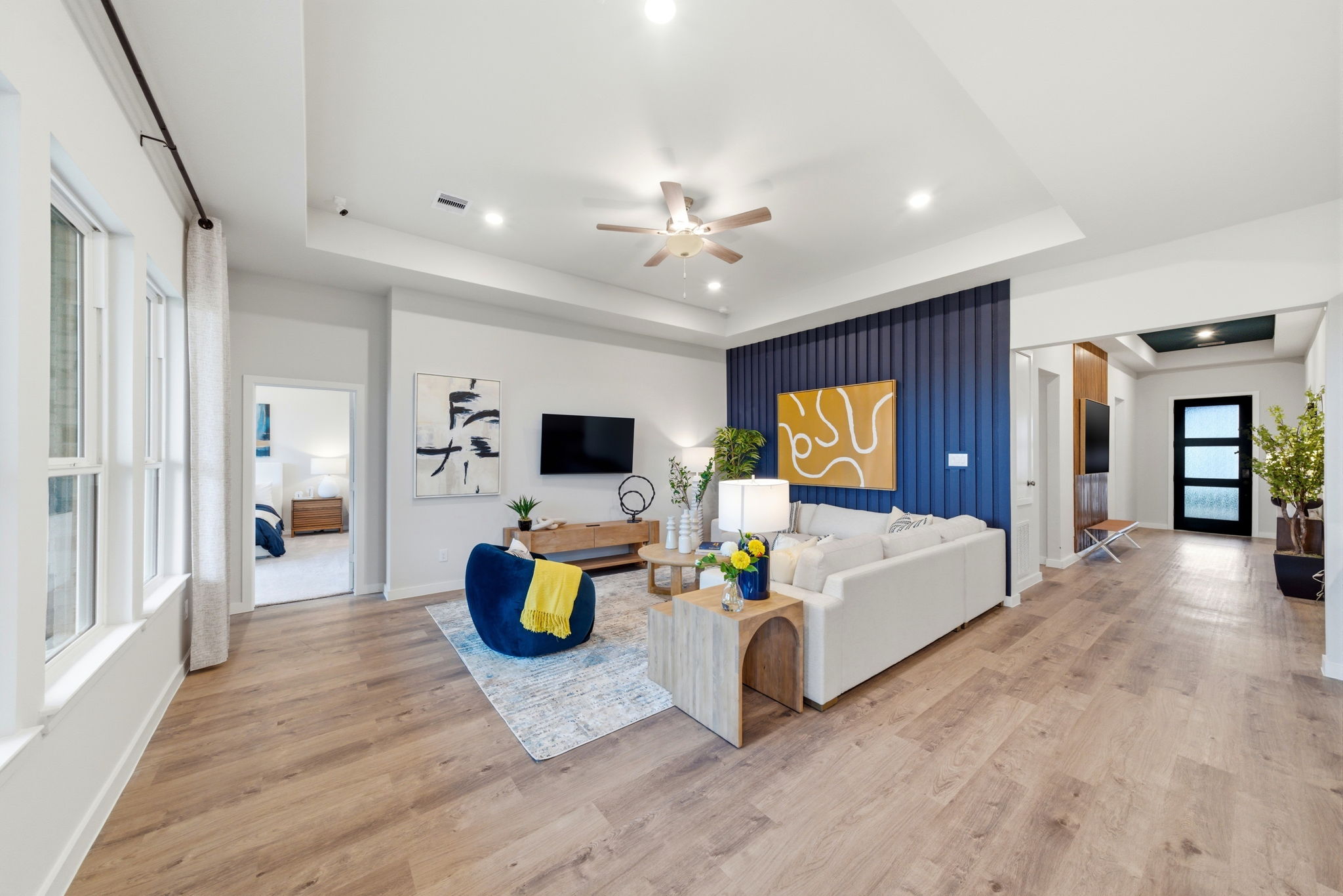 A living room with a wood floor.