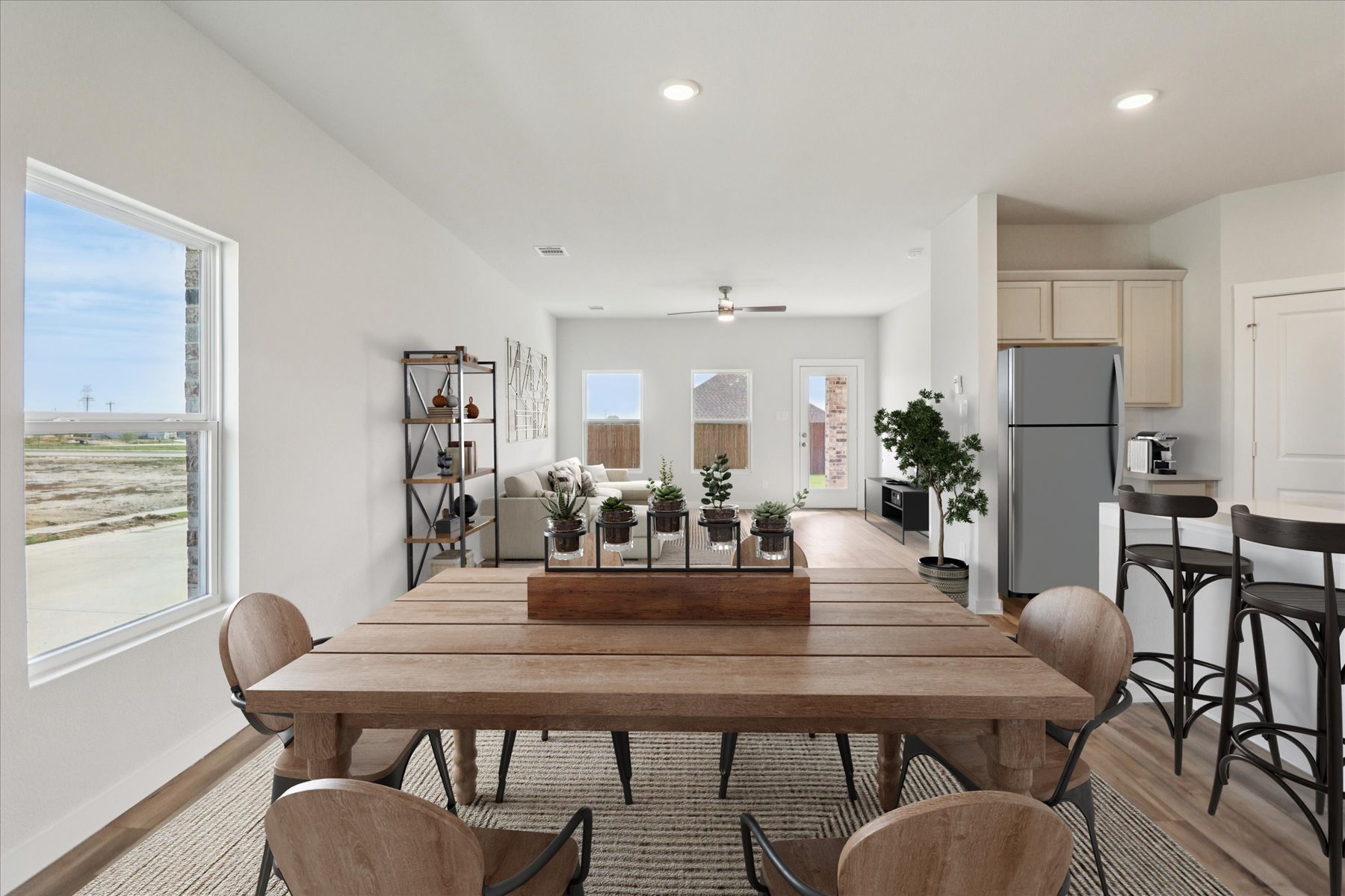 A dining room table with chairs.