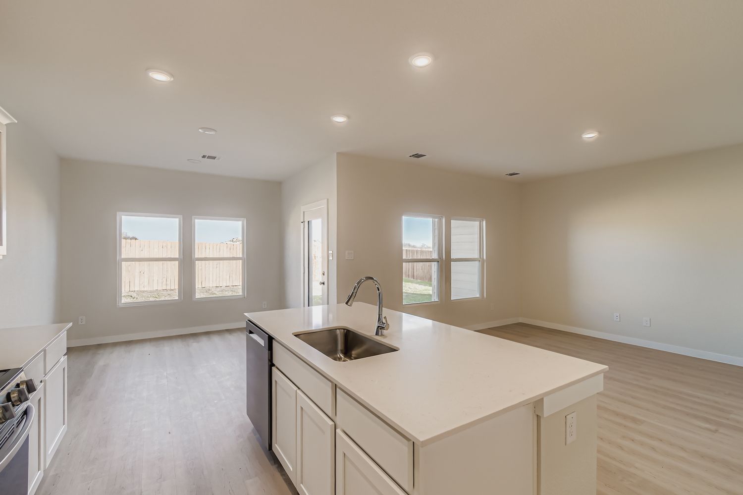 A kitchen with a sink and cabinets.