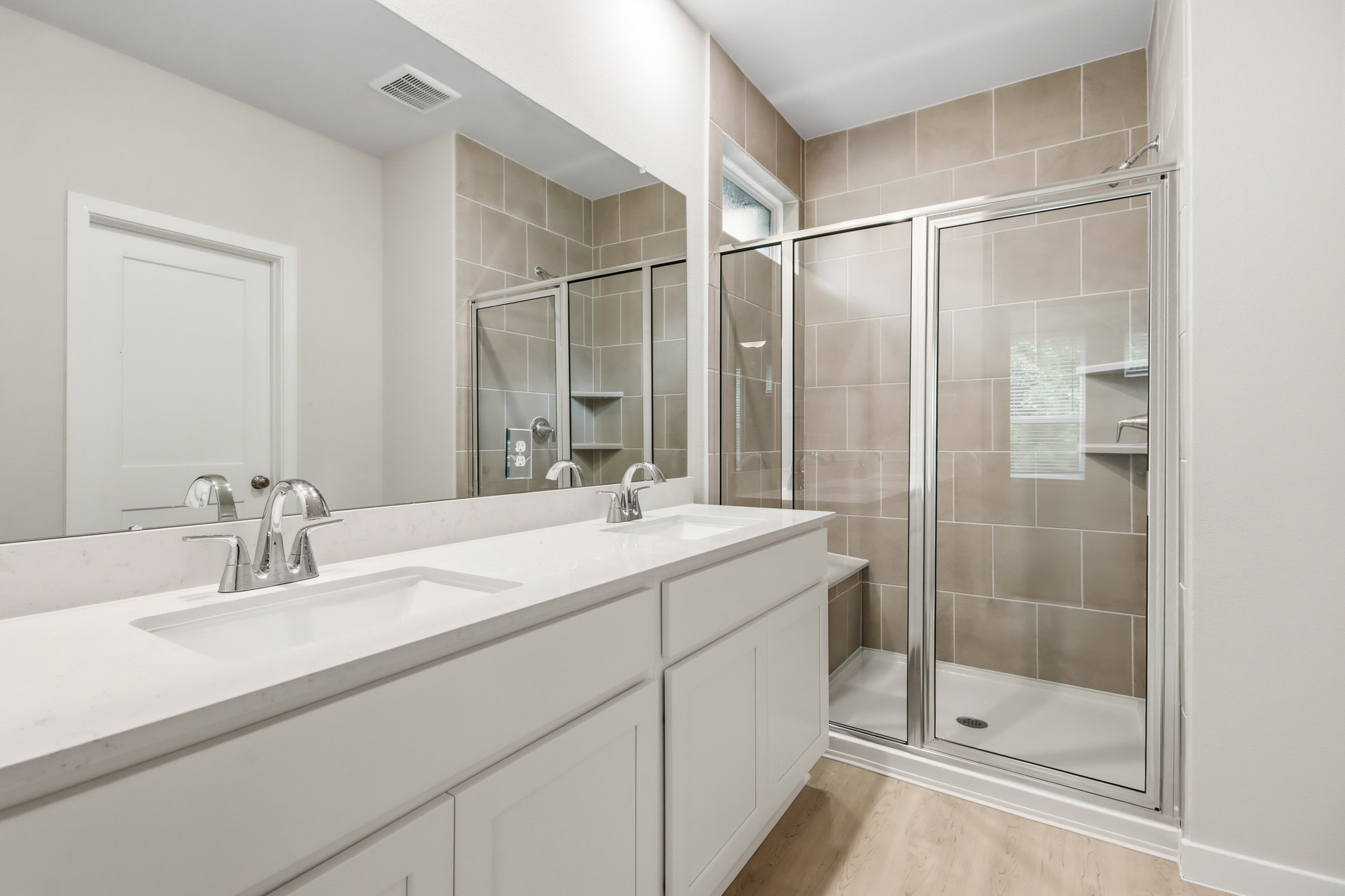 A bathroom with a glass shower.
