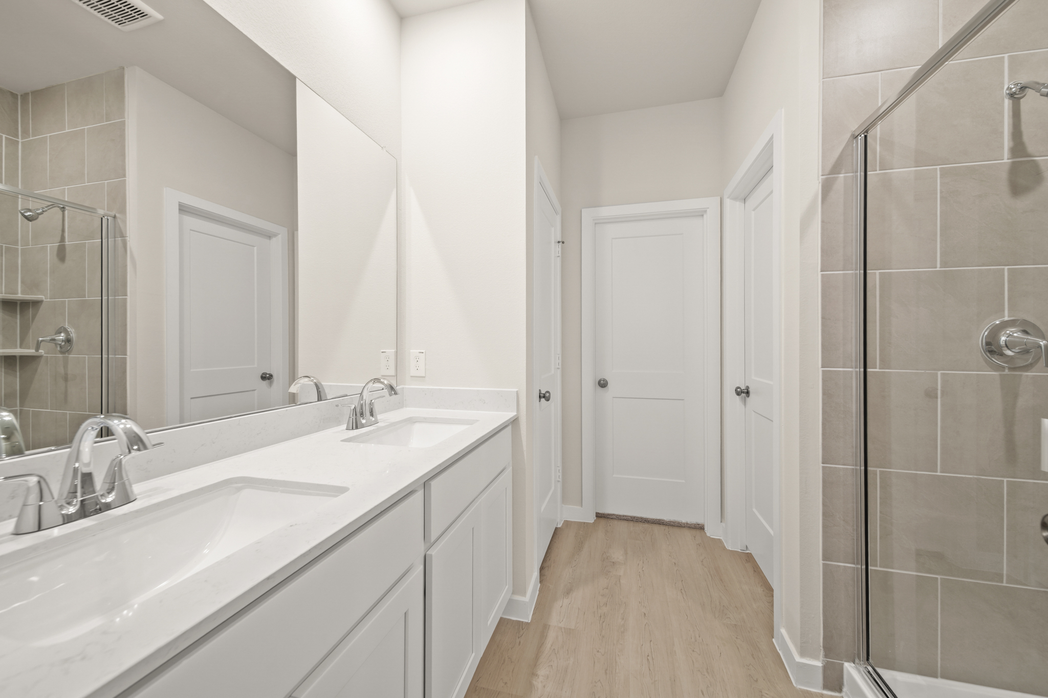 A bathroom with a glass shower.