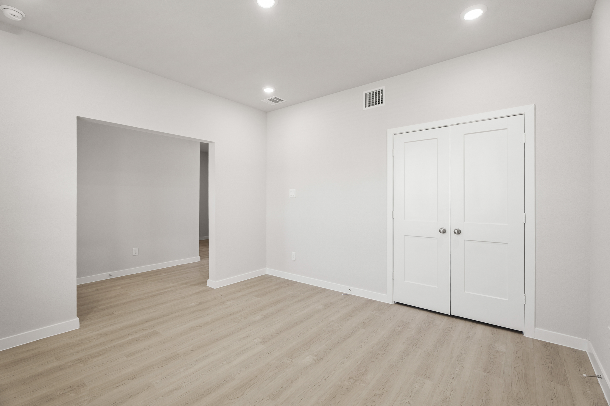 A room with white doors.