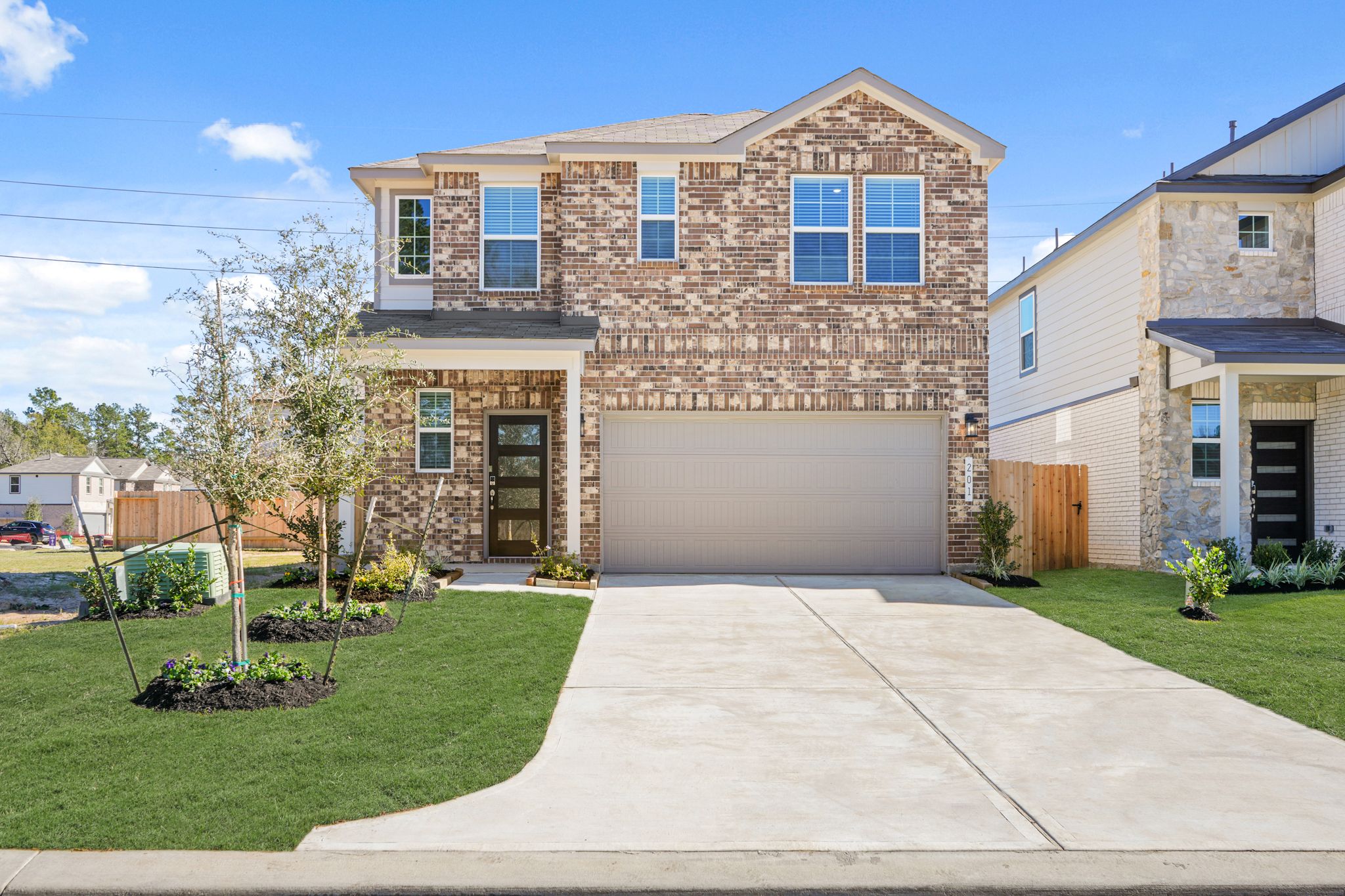 A driveway leading to a house.