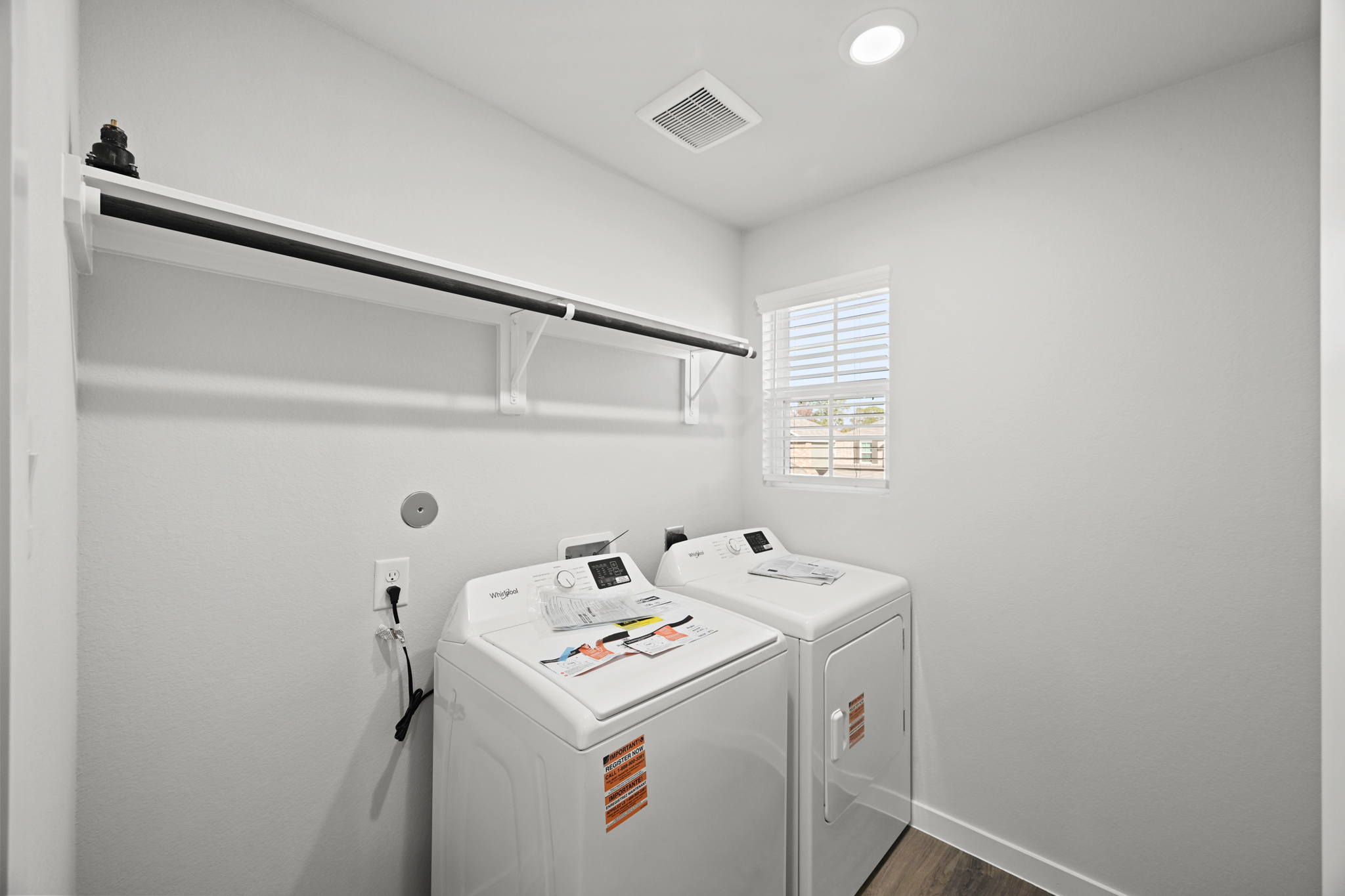A laundry room with a washer and dryer.