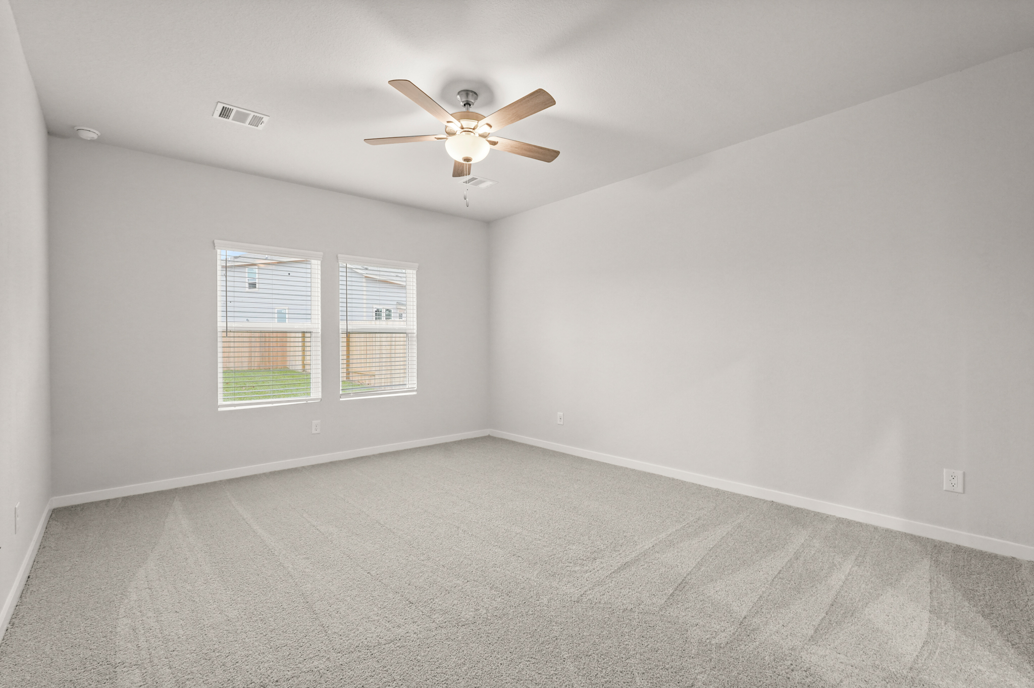 A ceiling fan in a room.