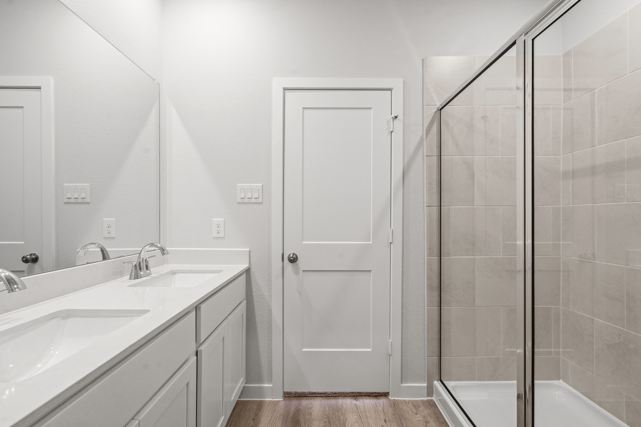 A bathroom with a glass shower.