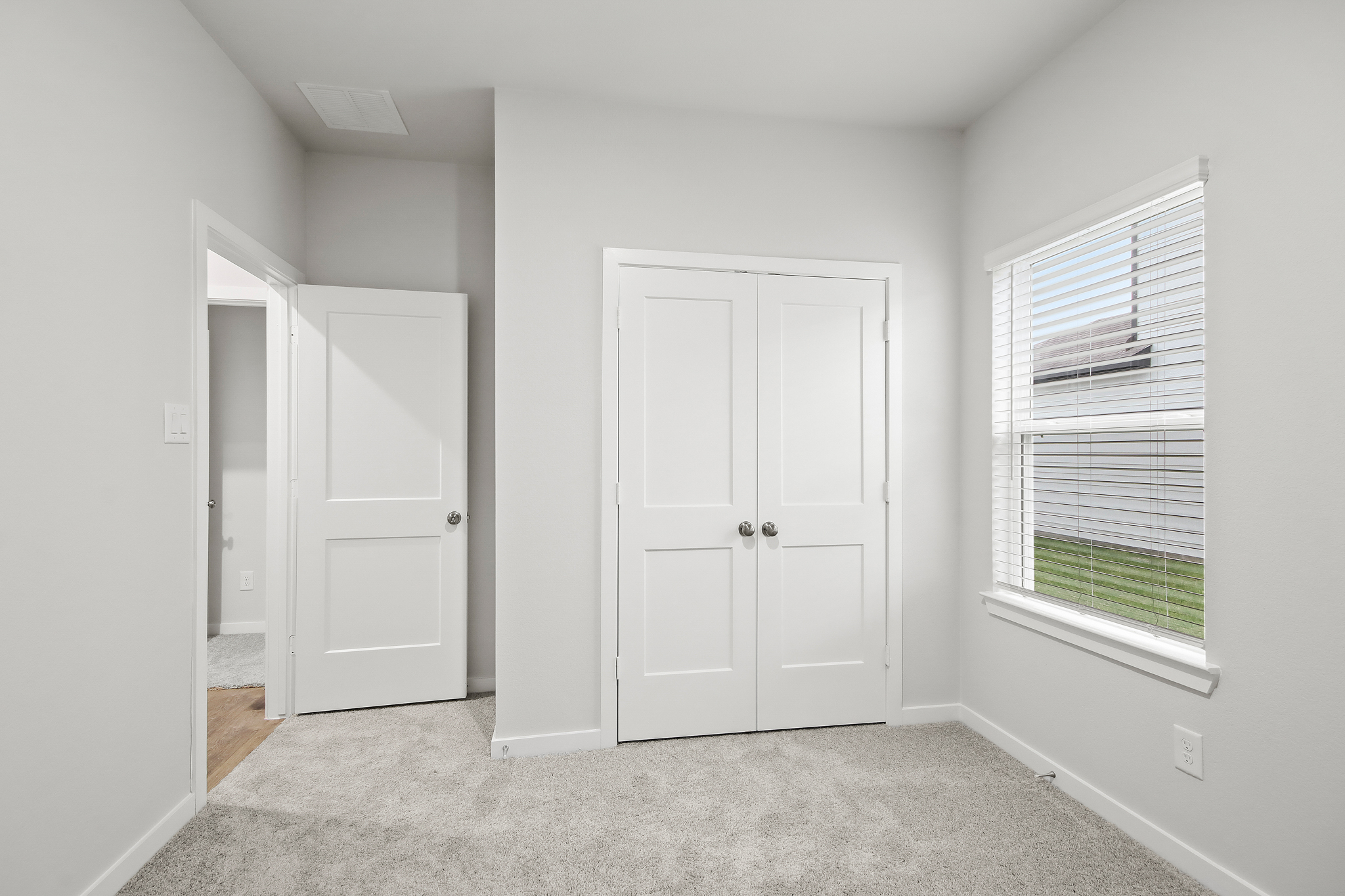 A room with white doors.