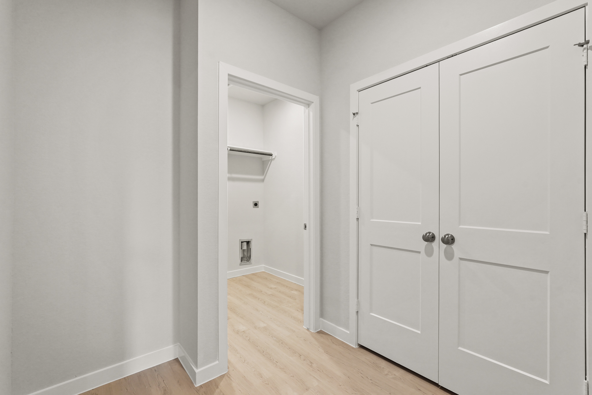 A room with white cabinets.