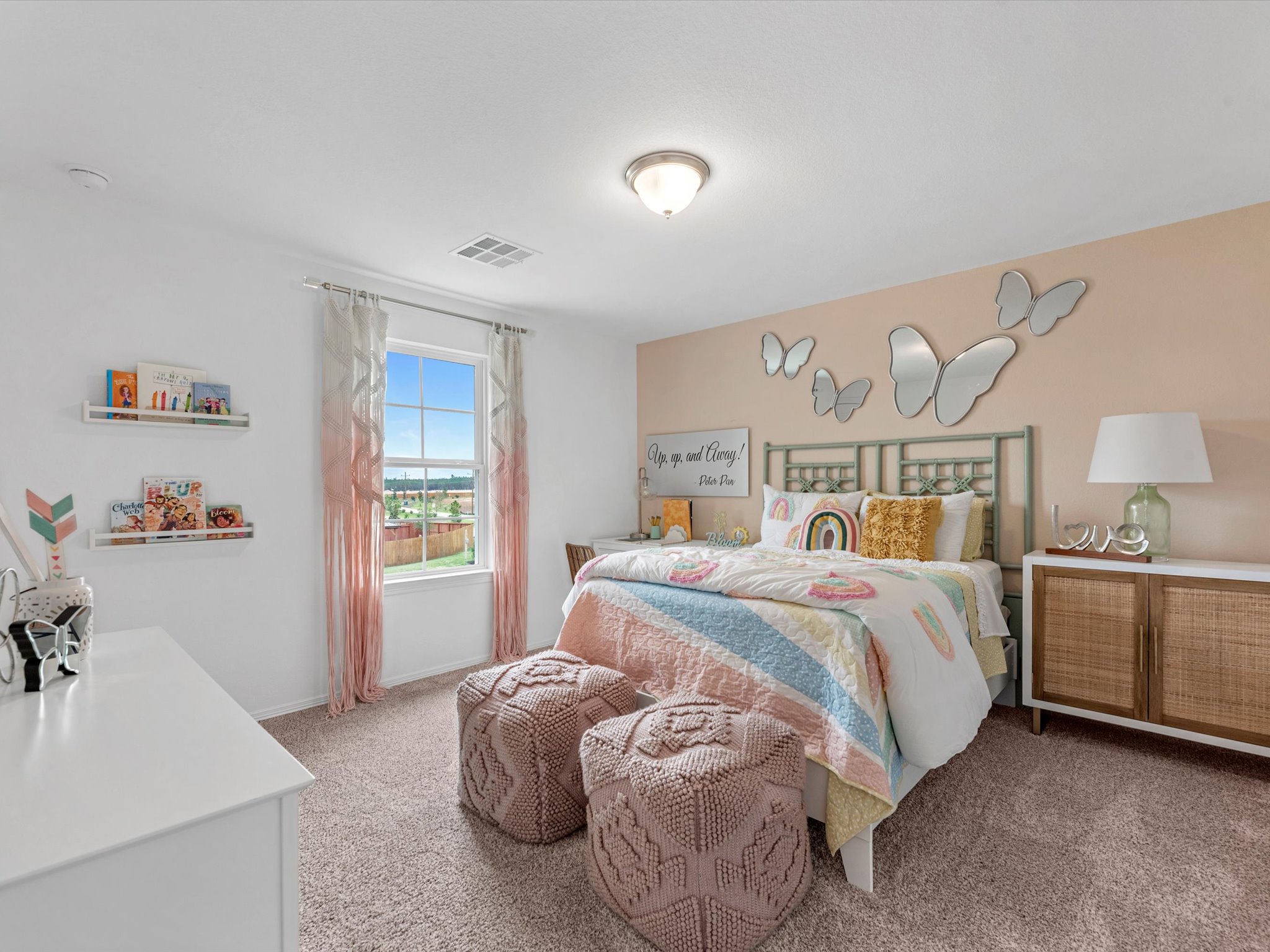 A bedroom with a bed and a chair.