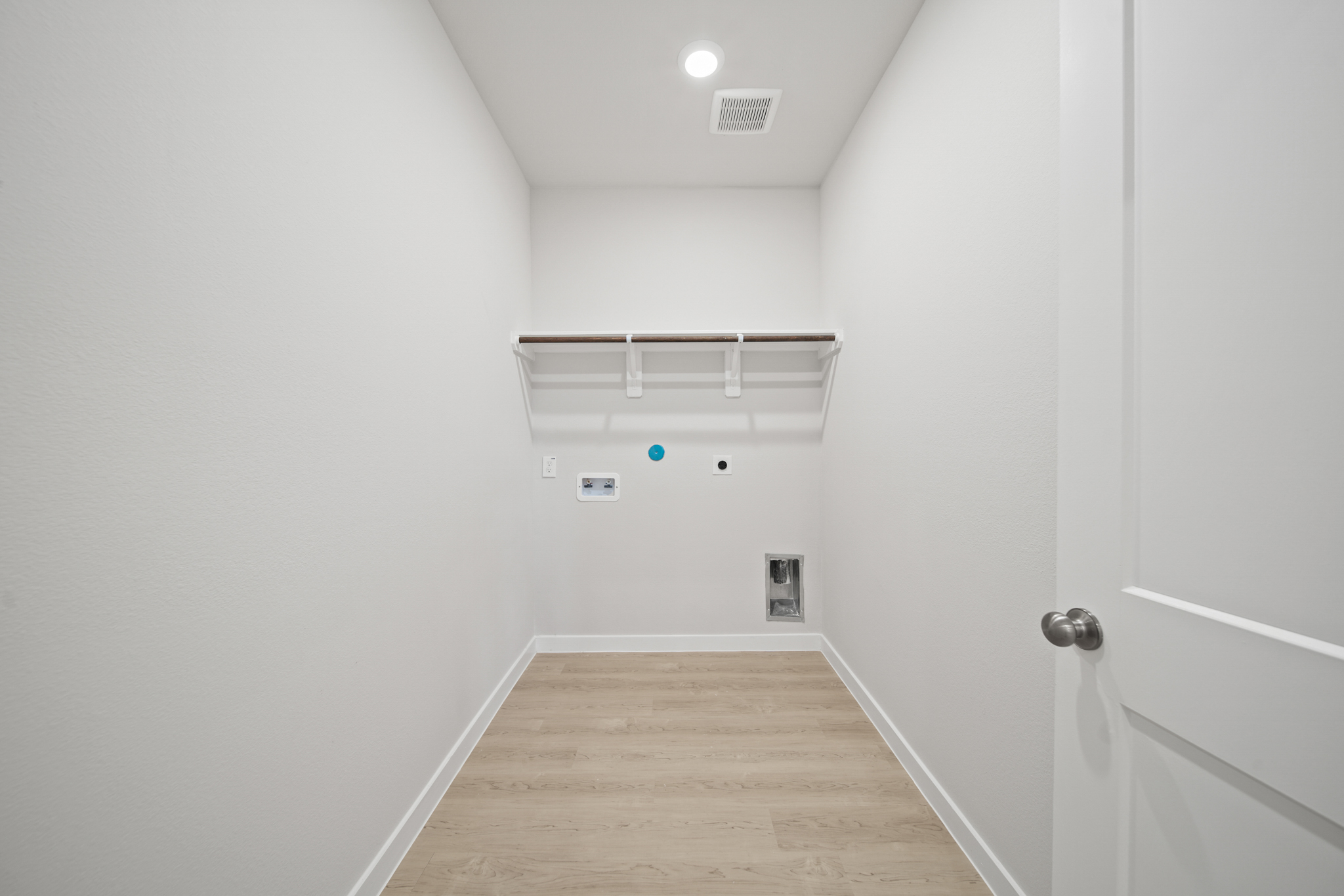 A hallway with white walls.