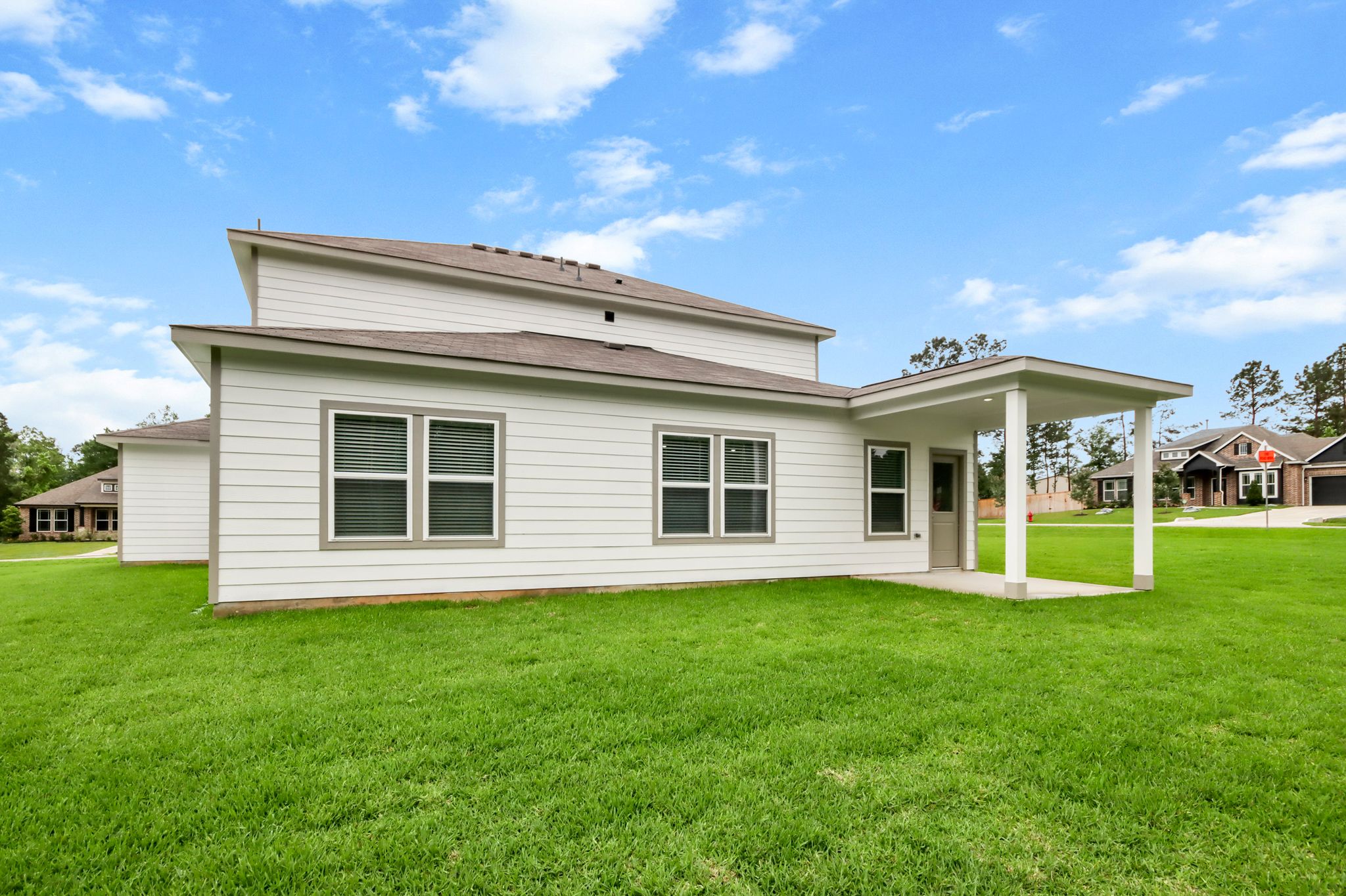 A house with a grass yard.