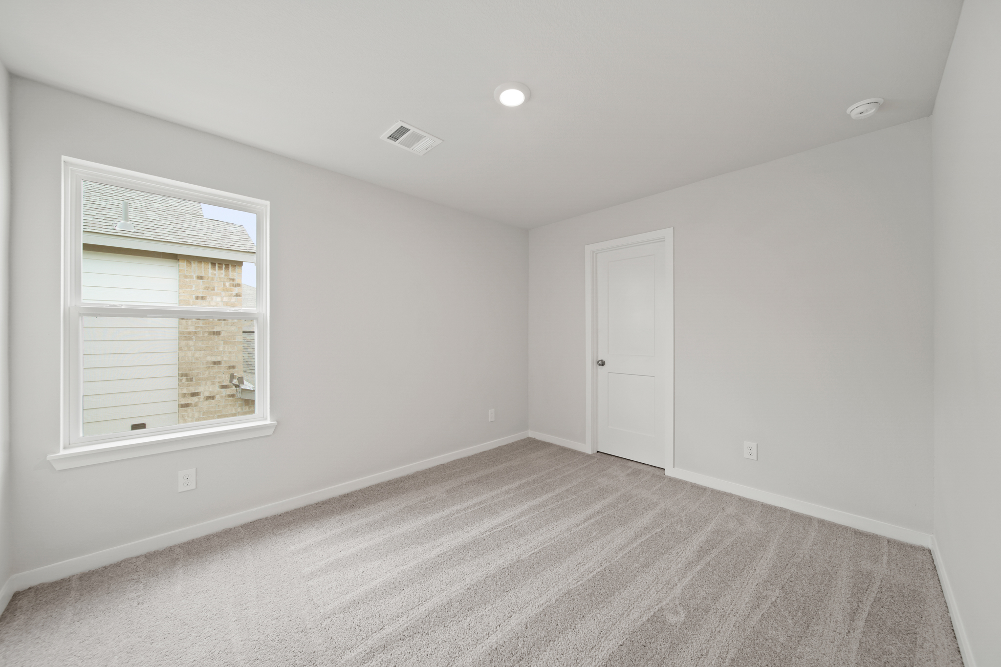 A room with a door and a window.