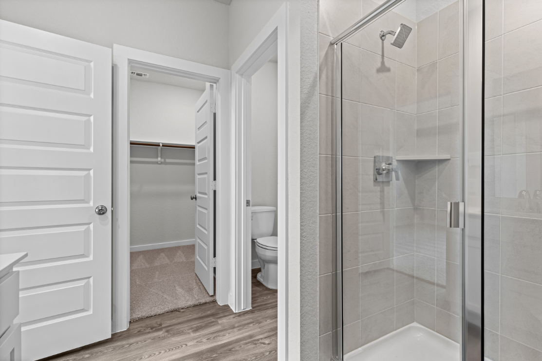 A bathroom with a glass shower.