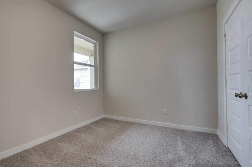 A room with a door and a window.