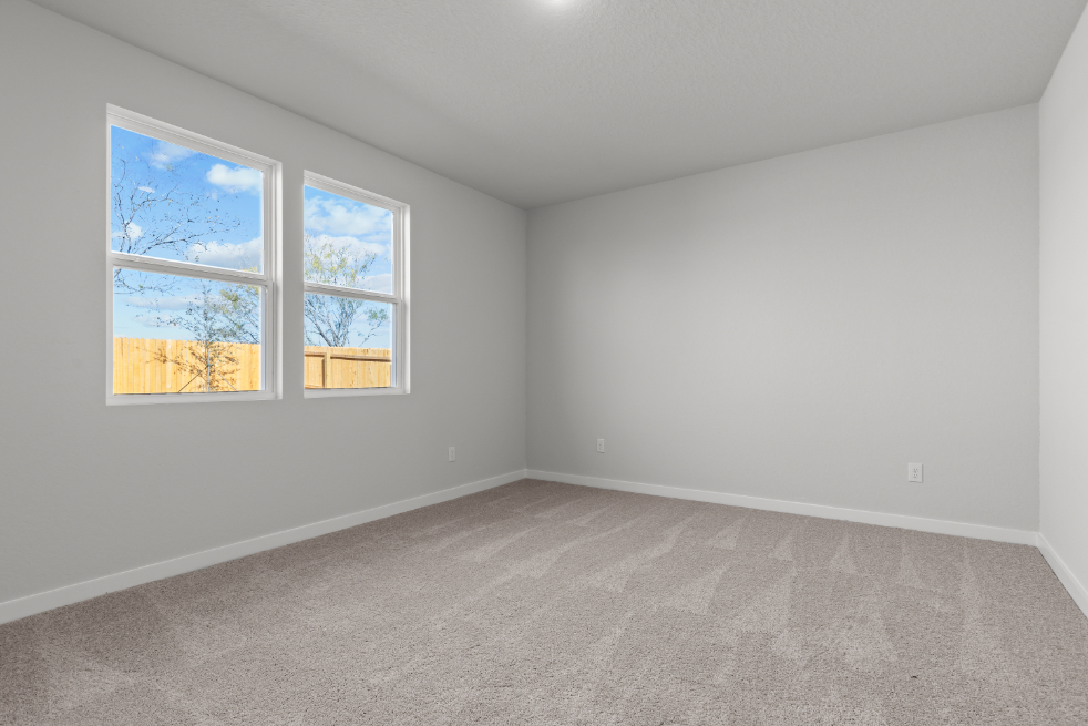 A room with a couple of windows.