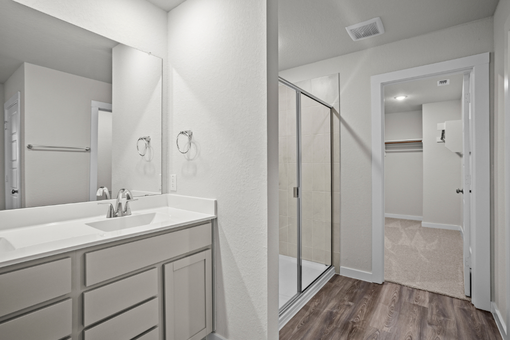 A bathroom with a glass shower.