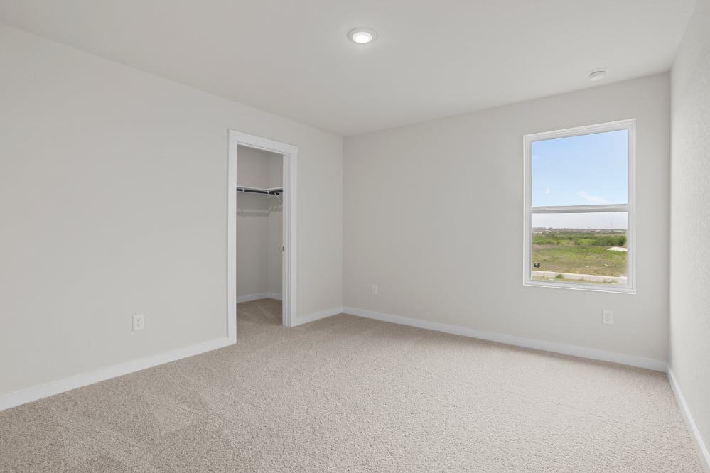 A room with a window and a door.