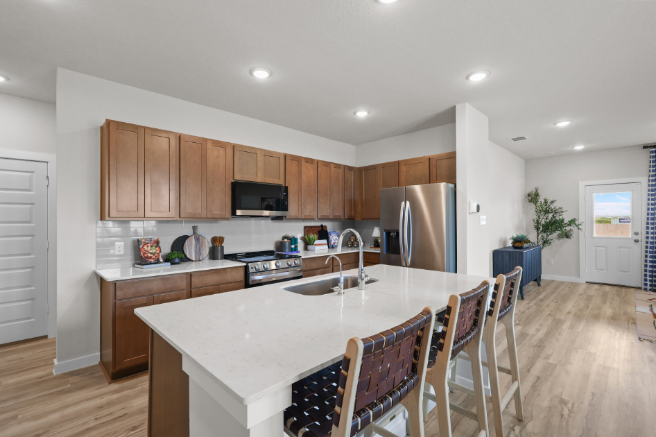 A kitchen with a dining table.