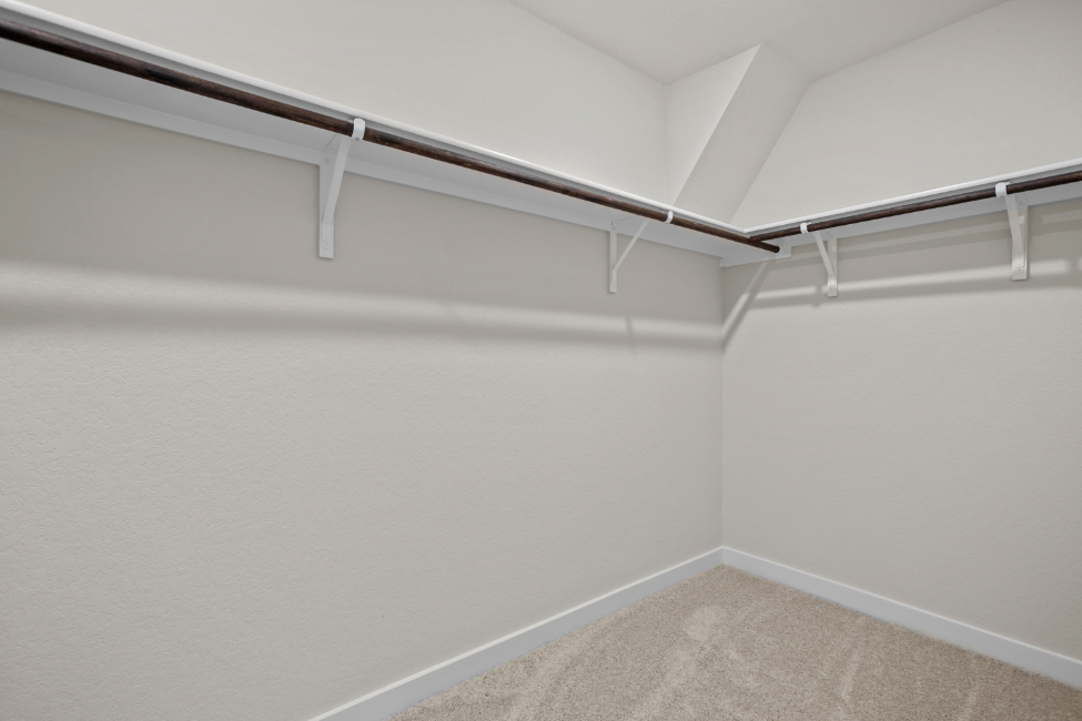 A white wall with a white railing.