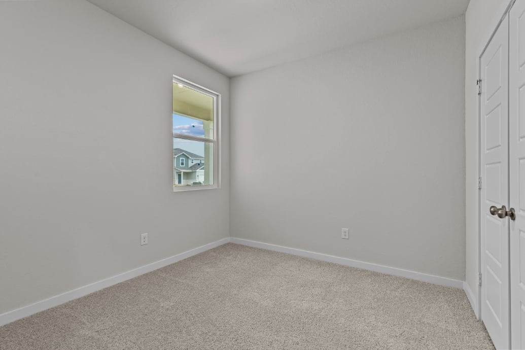 A room with a door and a window.